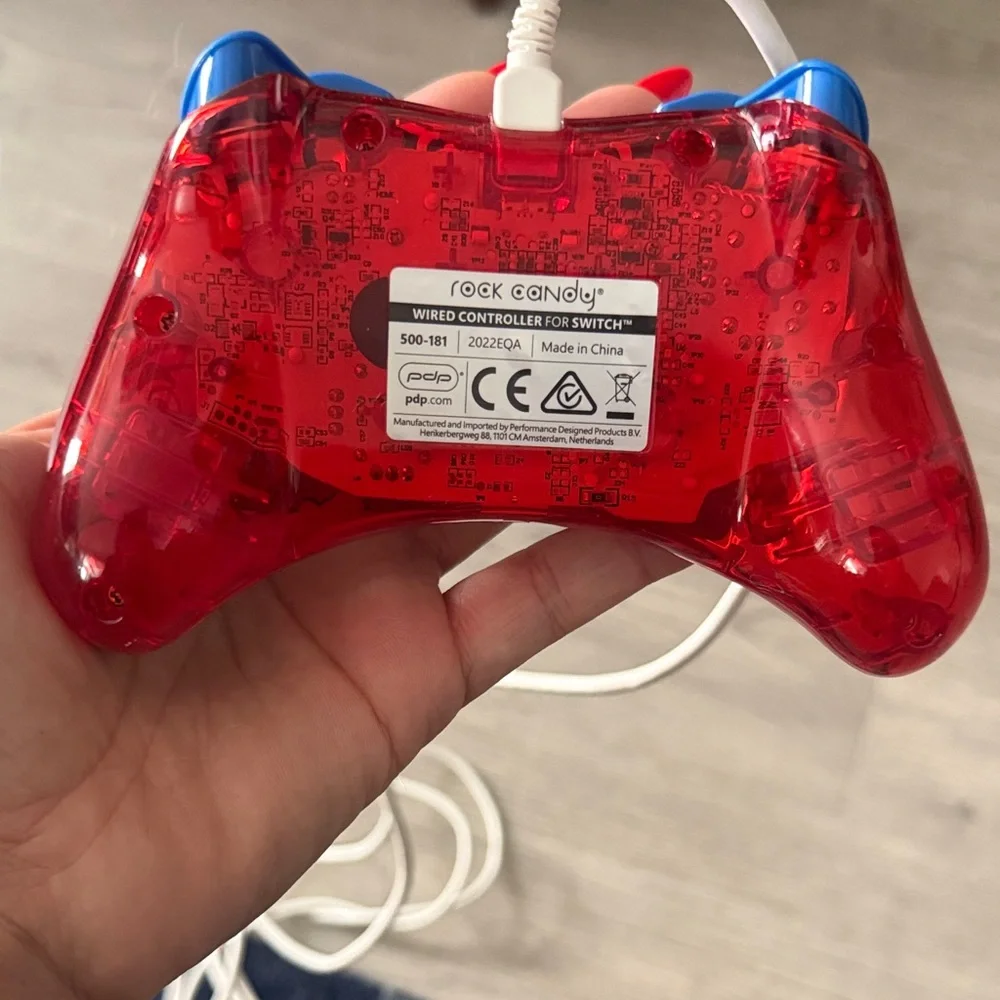 Nintendo Switch Red and Blue Controller with Mario Graphic